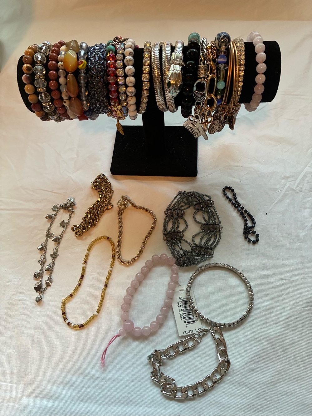 33 Vintage and modern bracelets. Some are stretchy and some aren’t.